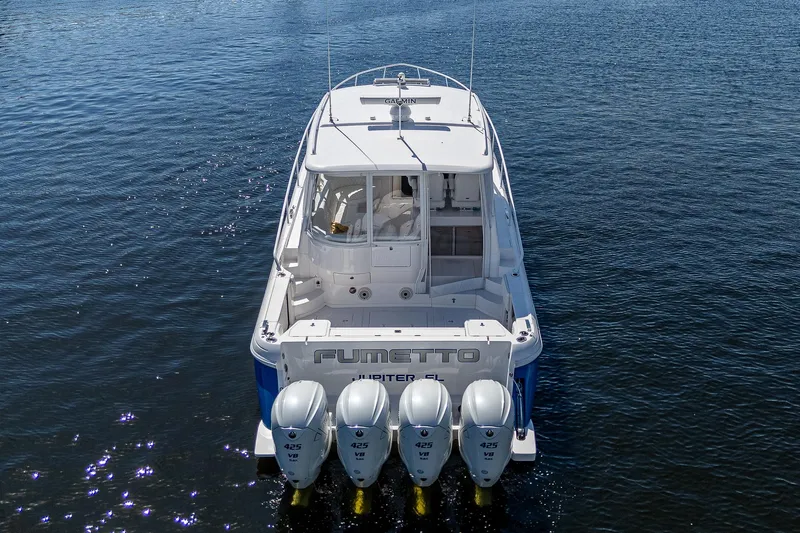  Yacht Photos Pics 2020 Intrepid 477 Evolution boat with quad engines on water.