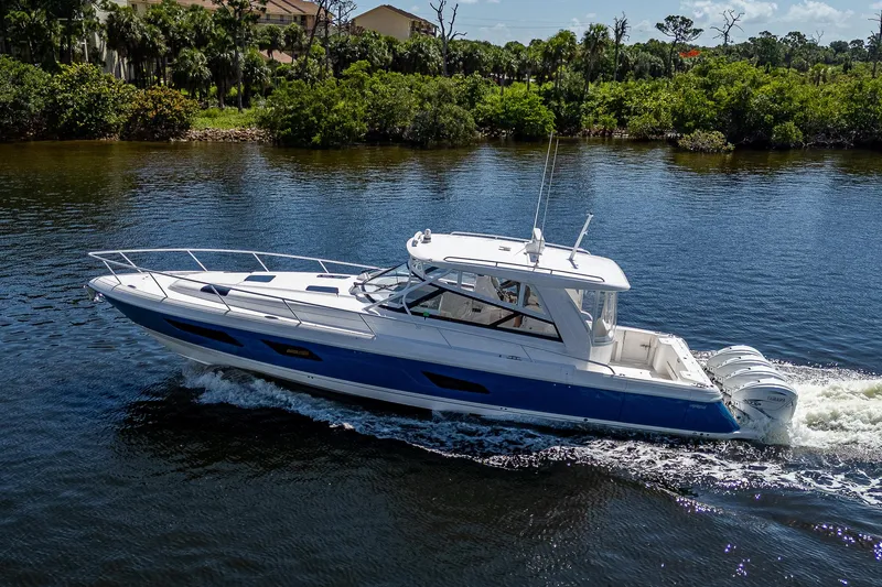  Yacht Photos Pics 2020 Intrepid 477 Evolution cruising on a scenic river.