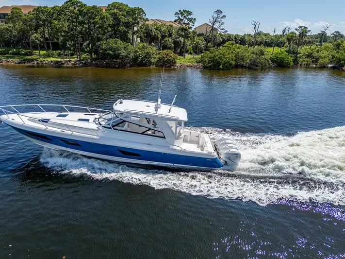 Yacht Photos Pics 2020 Intrepid 477 Evolution cruising on a scenic river.