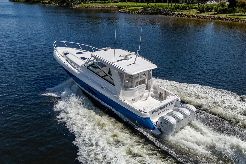  Yacht Photos Pics 2020 Intrepid 477 Evolution boat cruising on a river.