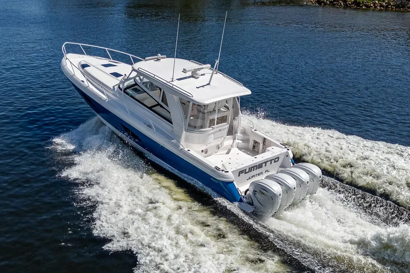  Yacht Photos Pics 2020 Intrepid 477 Evolution boat cruising on water.