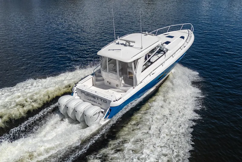  Yacht Photos Pics 2020 Intrepid 477 Evolution boat cruising on water.