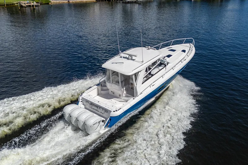  Yacht Photos Pics 2020 Intrepid 477 Evolution boat cruising on water.