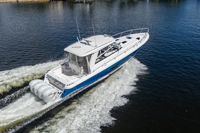 Yacht Photos Pics 2020 Intrepid 477 Evolution boat cruising on water.