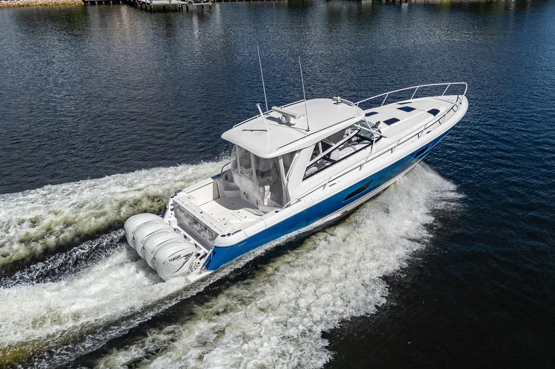  Yacht Photos Pics 2020 Intrepid 477 Evolution boat cruising on water.