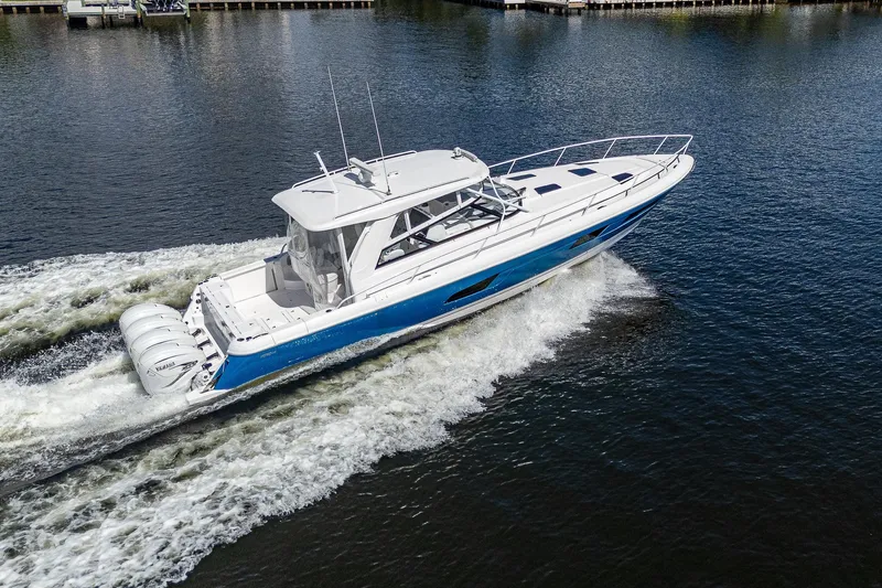  Yacht Photos Pics 2020 Intrepid 477 Evolution boat cruising on water.