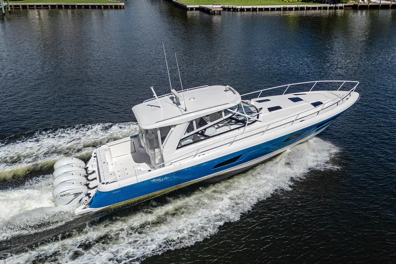  Yacht Photos Pics 2020 Intrepid 477 Evolution boat cruising on water.