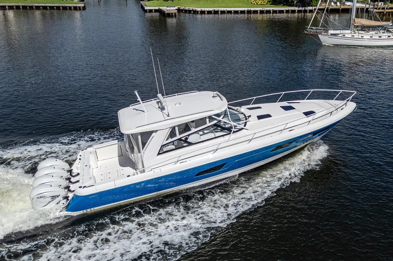  Yacht Photos Pics 2020 Intrepid 477 Evolution boat cruising on a calm waterway.