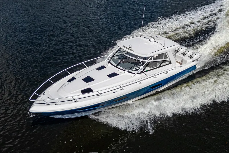  Yacht Photos Pics 2020 Intrepid 477 Evolution boat cruising on water.