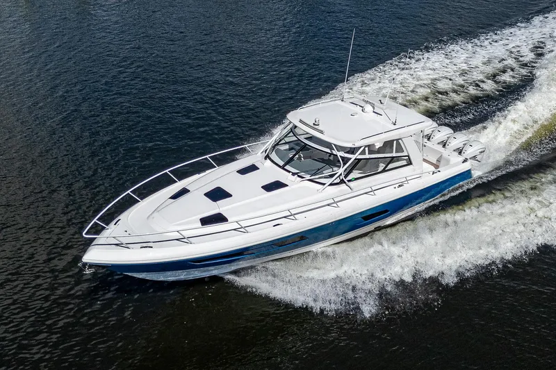  Yacht Photos Pics 2020 Intrepid 477 Evolution boat cruising on water.