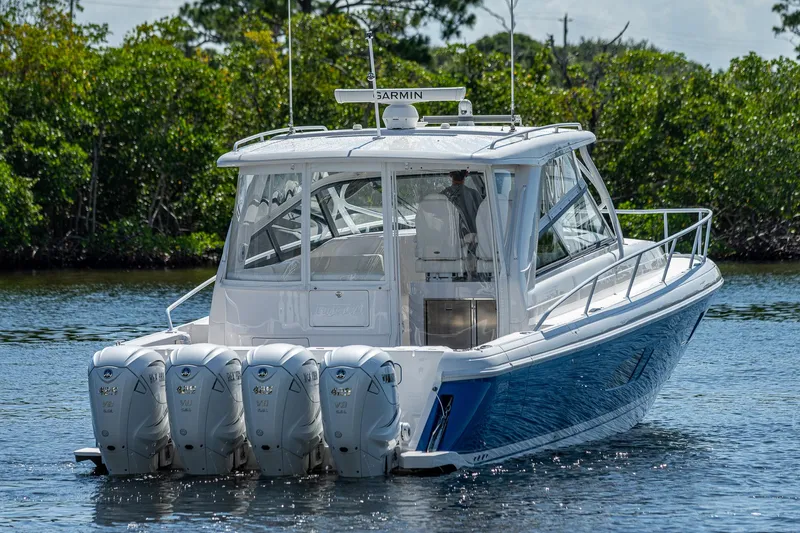  Yacht Photos Pics 2020 Intrepid 477 Evolution boat with four outboard engines on the water.