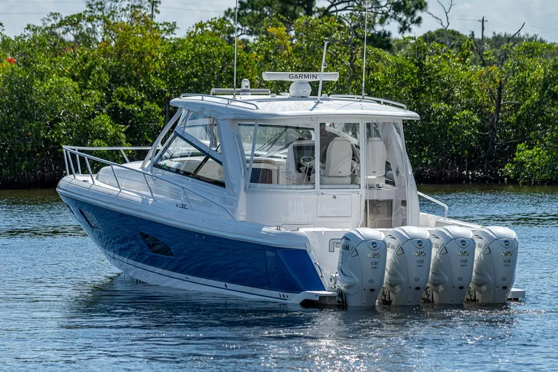  Yacht Photos Pics 2020 Intrepid 477 Evolution boat with four outboard engines on the water.