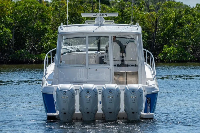  Yacht Photos Pics 2020 Intrepid 477 Evolution boat with four outboard engines on the water.