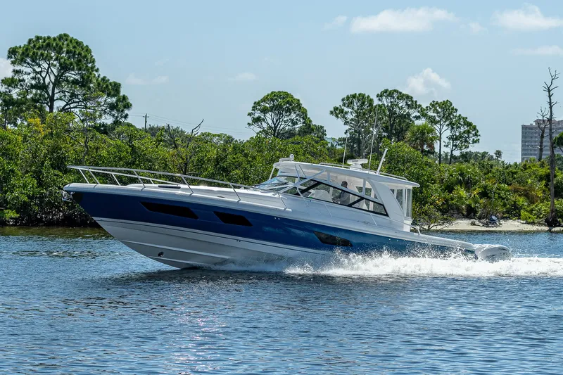  Yacht Photos Pics 2020 Intrepid 477 Evolution boat cruising on a sunny day.