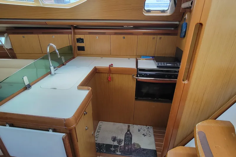  Yacht Photos Pics Interior of 2008 Jeanneau Sun Odyssey 42 DS yacht kitchen with modern amenities.