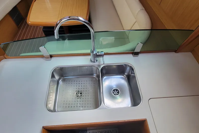  Yacht Photos Pics Modern kitchen sink on 2008 Jeanneau Sun Odyssey 42 DS yacht, featuring dual basins and sleek design.