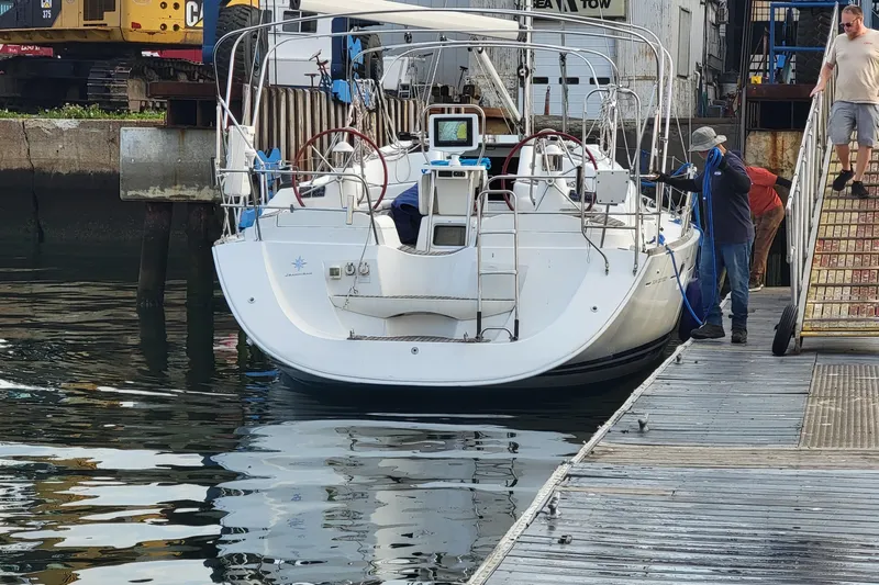  Yacht Photos Pics 2008 Jeanneau Sun Odyssey 42 DS docked at marina with people boarding.