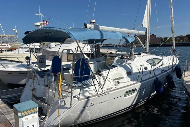  Yacht Photos Pics 2008 Jeanneau Sun Odyssey 42 DS sailboat docked at marina under clear blue sky.