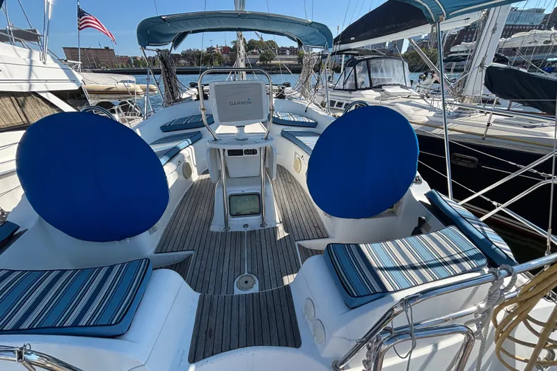  Yacht Photos Pics 2008 Jeanneau Sun Odyssey 42 DS sailboat cockpit with striped cushions and Garmin navigation.