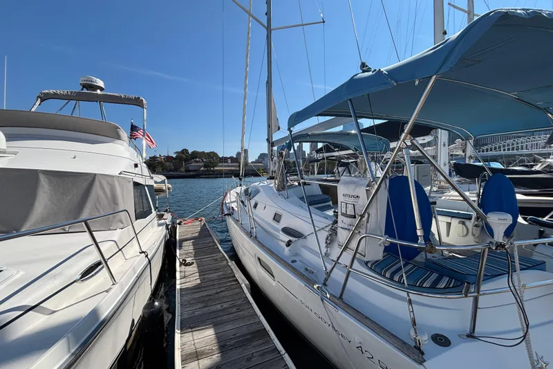  Yacht Photos Pics 2008 Jeanneau Sun Odyssey 42 DS sailboat docked at marina under clear blue sky.