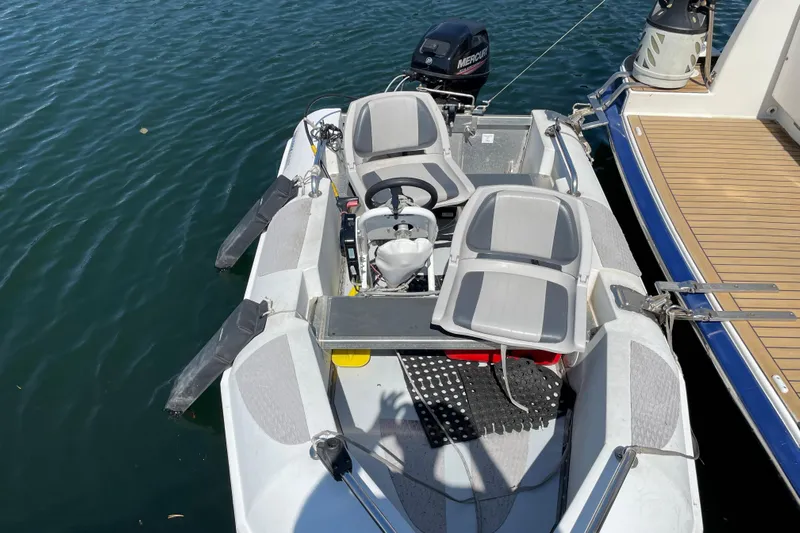  Yacht Photos Pics Inflatable boat with motor docked beside a 2007 Fathom Yachts 40.