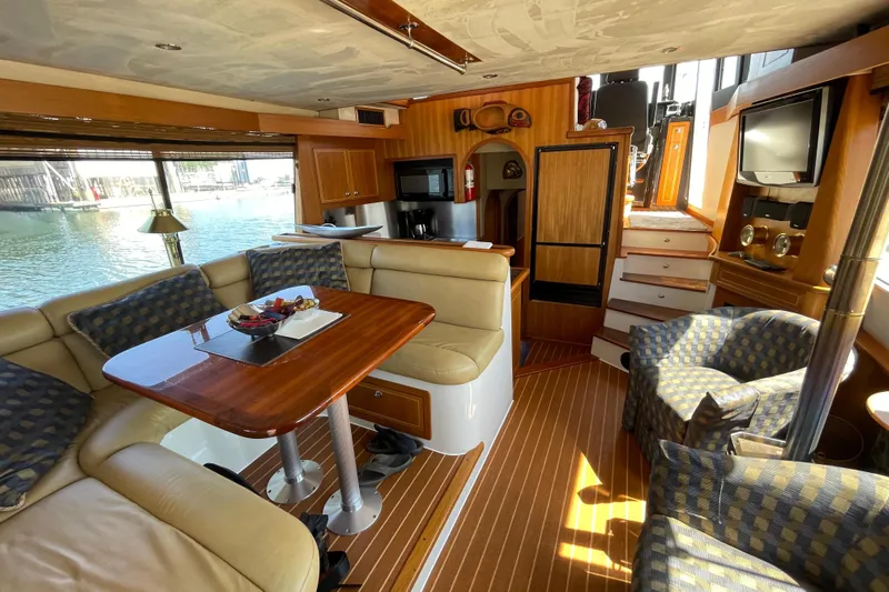  Yacht Photos Pics Luxurious interior of 2007 Fathom Yachts 40 with elegant seating and wooden finishes.