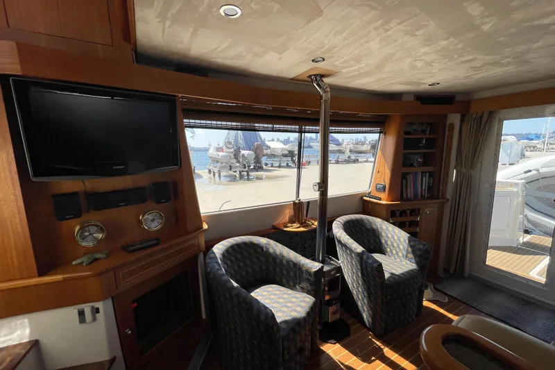  Yacht Photos Pics Interior of 2007 Fathom Yachts 40, featuring cozy seating and a waterfront view.