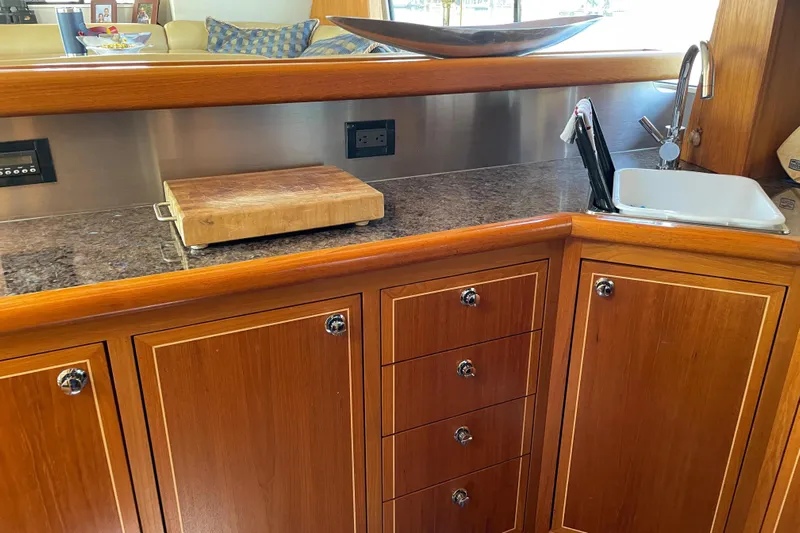  Yacht Photos Pics Luxurious 2007 Fathom Yachts 40 galley with wooden cabinetry and modern amenities.