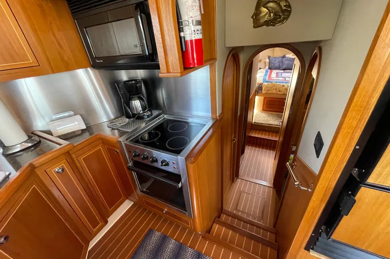  Yacht Photos Pics Luxurious 2007 Fathom Yachts 40 interior with modern kitchen and cozy cabin.