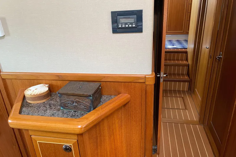  Yacht Photos Pics Interior of 2007 Fathom Yachts 40, featuring wood paneling and decorative items.