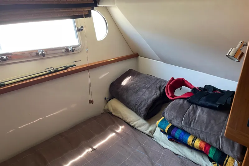  Yacht Photos Pics Cozy cabin interior of 2007 Fathom Yachts 40 with bed and window.