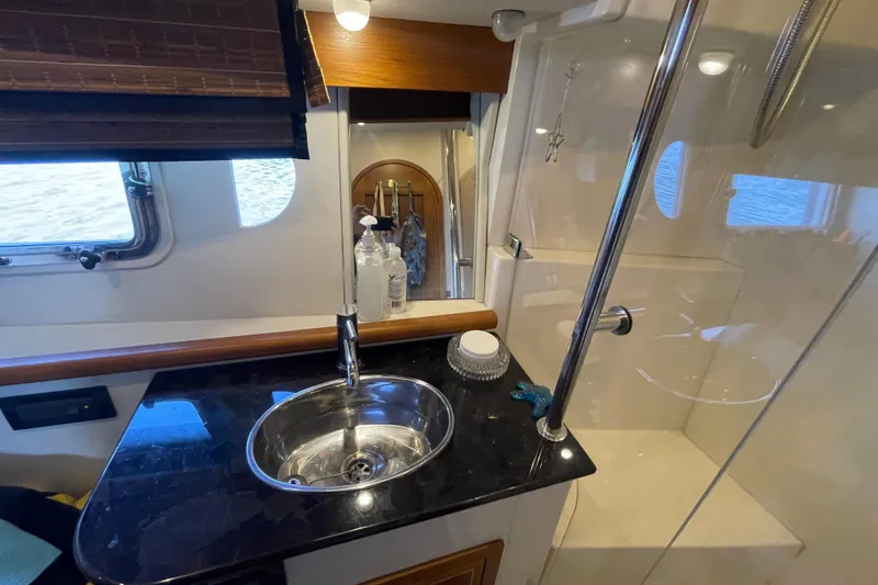  Yacht Photos Pics Luxurious bathroom interior of 2007 Fathom Yachts 40, featuring sleek sink and shower.