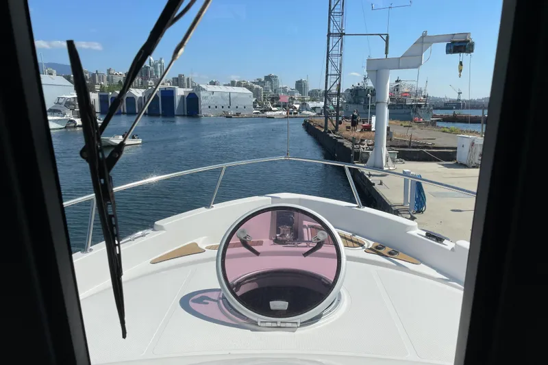 Yacht Photos Pics View from Fathom Yachts 40, 2007 model, navigating a marina with cityscape background.