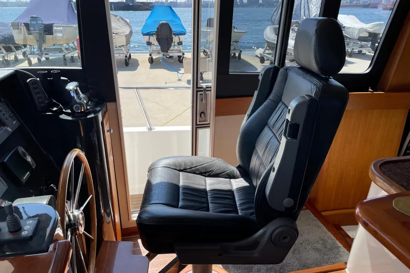  Yacht Photos Pics Captain's chair in 2007 Fathom Yachts 40 cockpit, overlooking marina.