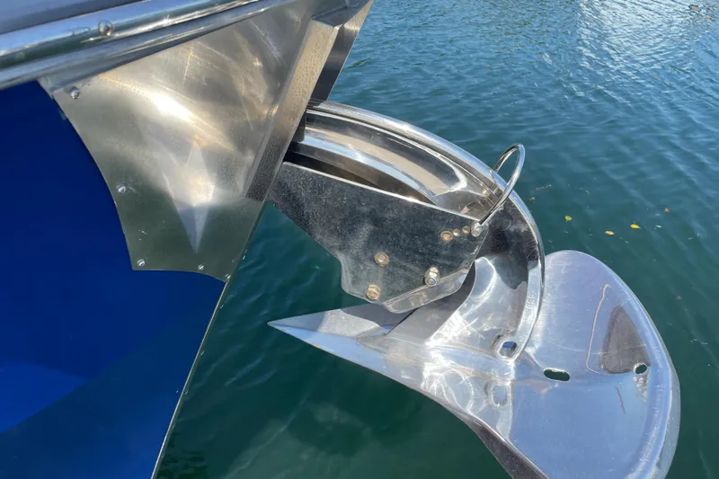  Yacht Photos Pics Close-up of a 2007 Fathom Yachts 40 anchor mechanism over water.