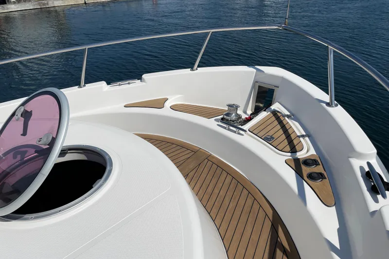  Yacht Photos Pics Bow view of 2007 Fathom Yachts 40, featuring teak decking and open hatch.