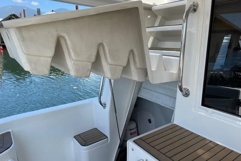  Yacht Photos Pics 2007 Fathom Yachts 40 interior with storage compartments and water view.