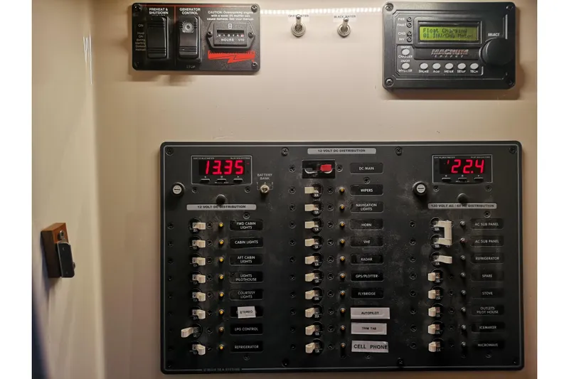  Yacht Photos Pics Electrical control panel on a 2007 Fathom Yachts 40, featuring various switches and displays.