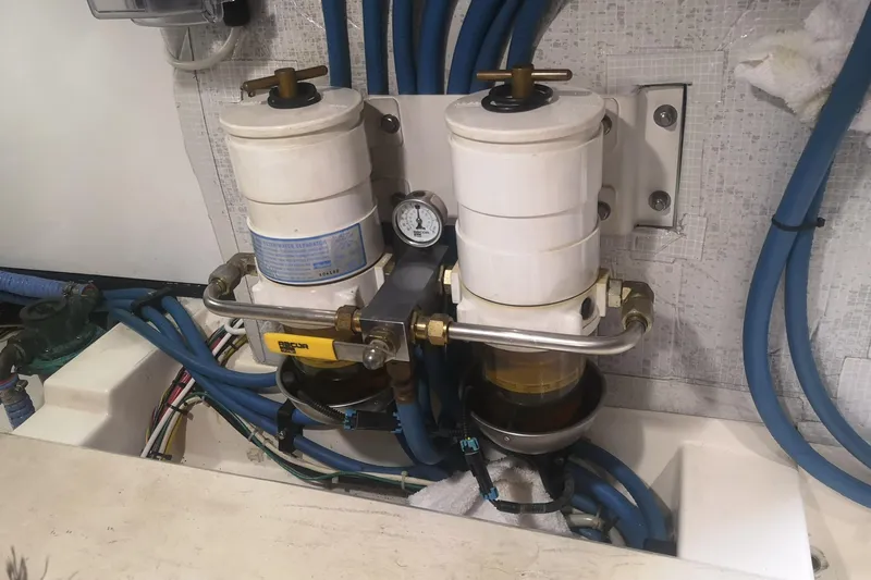  Yacht Photos Pics Fuel filtration system on a 2007 Fathom Yachts 40, featuring dual filters and blue hoses.
