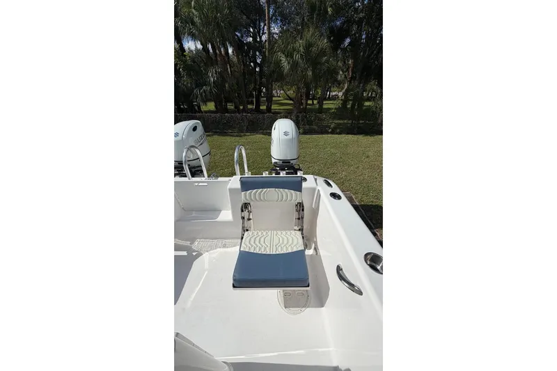  Yacht Photos Pics 2025 Twin Vee 260 GFX2 CC boat with dual outboard motors and seating.