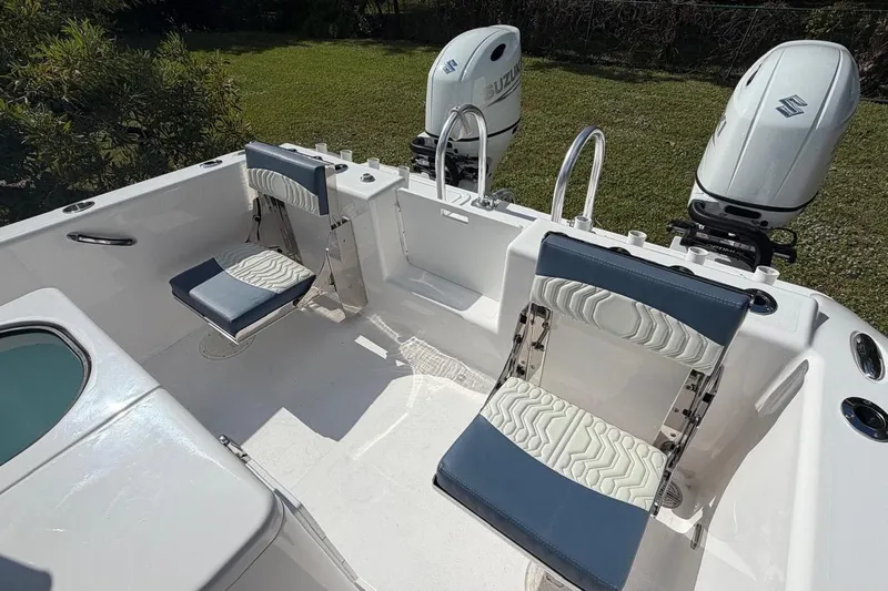  Yacht Photos Pics 2025 Twin Vee 260 GFX2 CC boat interior with seating and dual Suzuki outboard motors.
