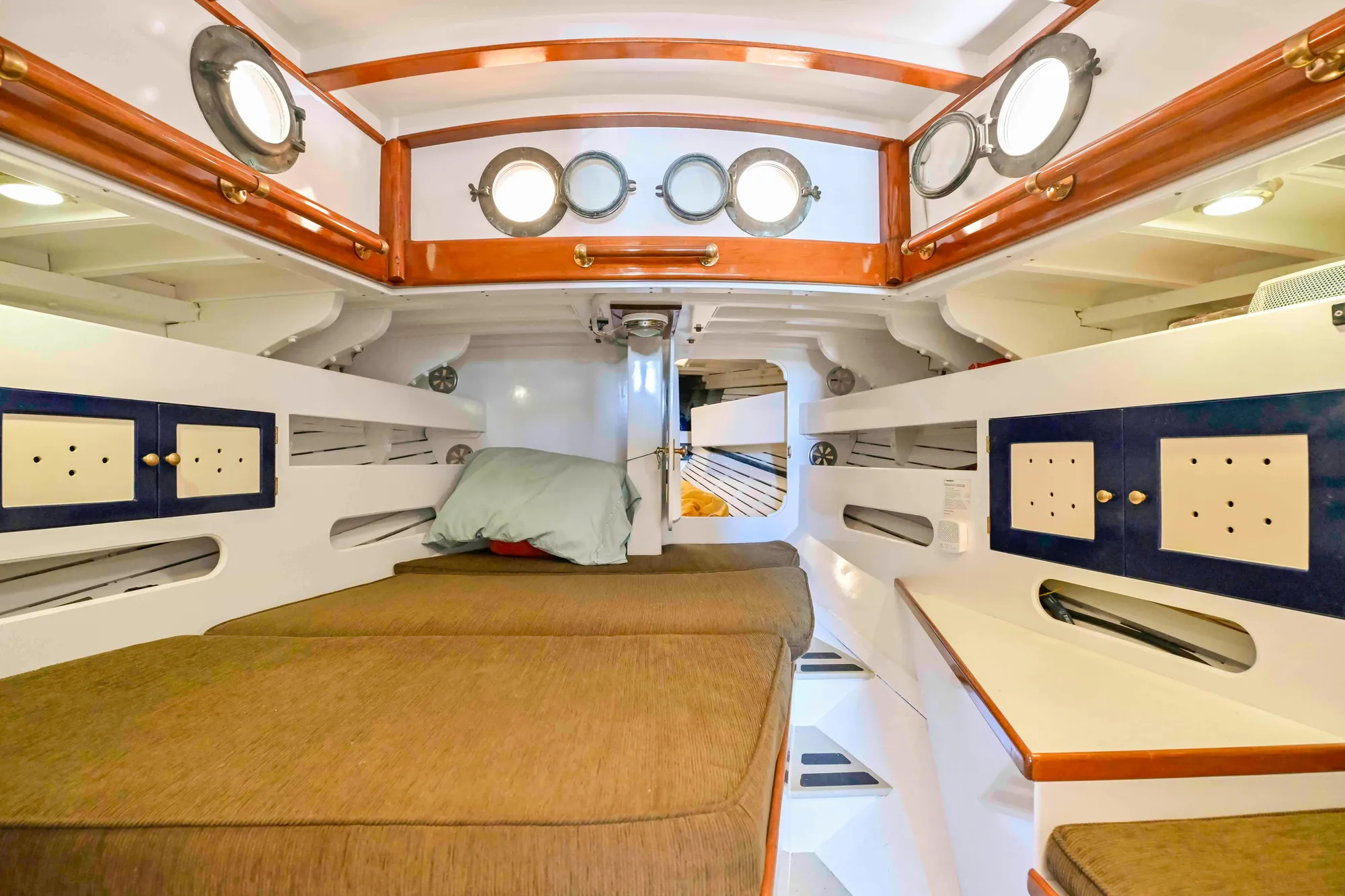Interior of 1927 Schock Staysail Schooner with cozy cabin and portholes.