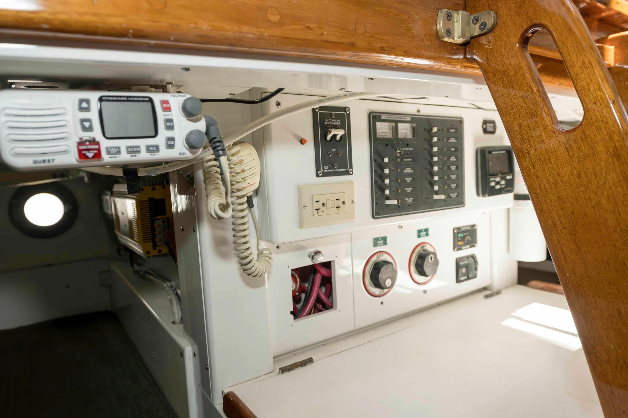 Interior view of 1927 Schock Staysail Schooner's control panel with radio and gauges.