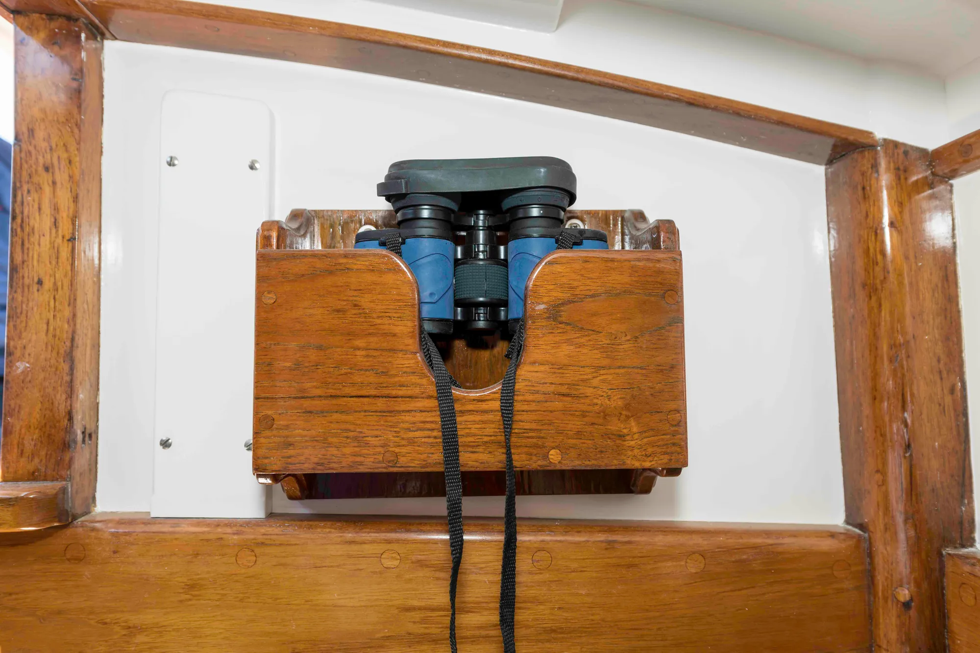Wooden binocular holder on 1927 Schock Staysail Schooner interior.