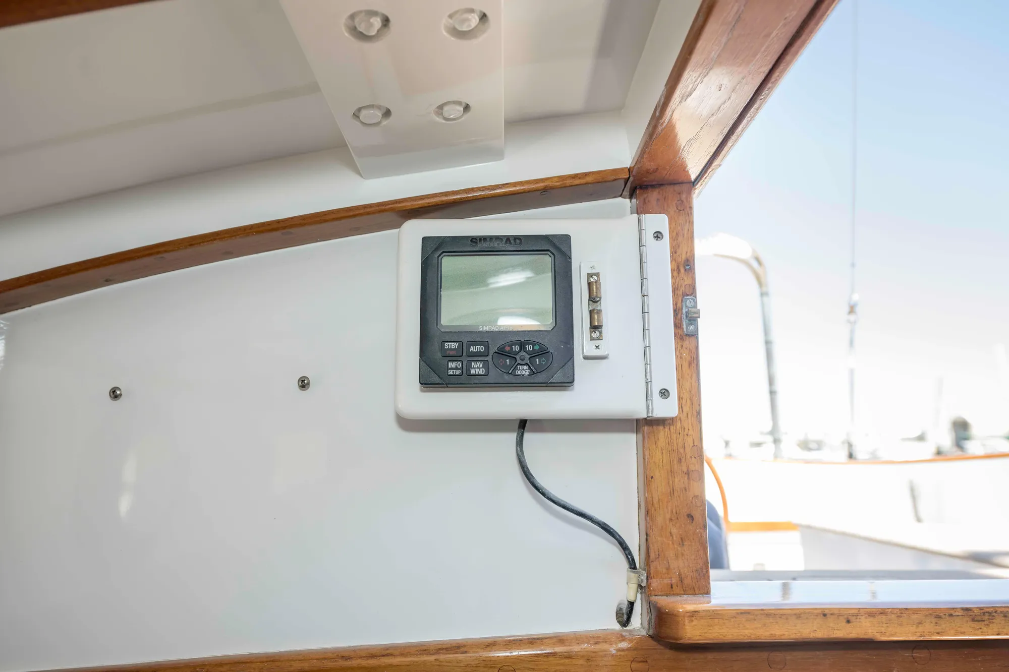 1927 Schock Staysail Schooner interior with navigation equipment and wooden trim.