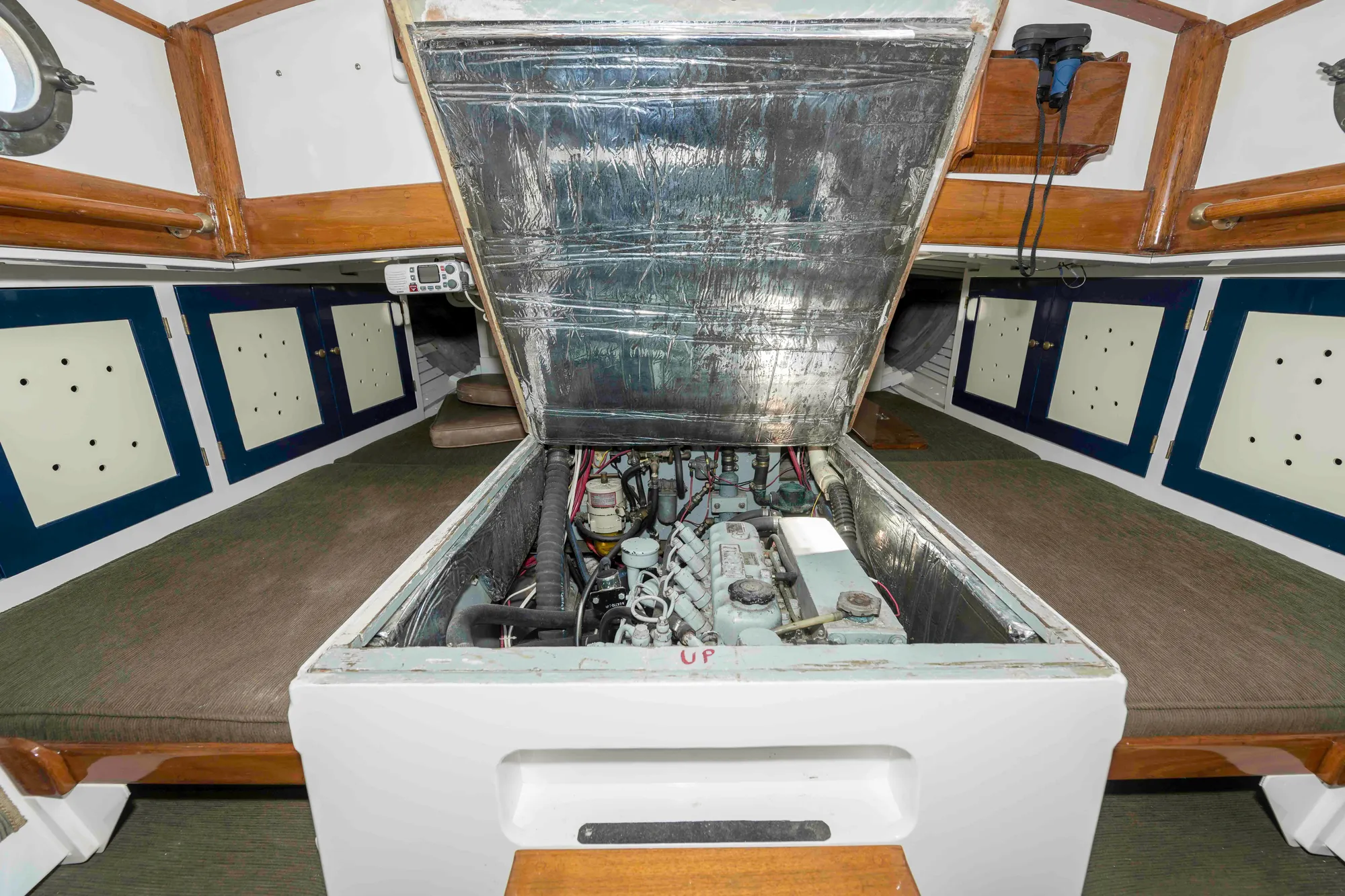 Engine compartment of a 1927 Schock Staysail Schooner, showcasing interior design and mechanical components.