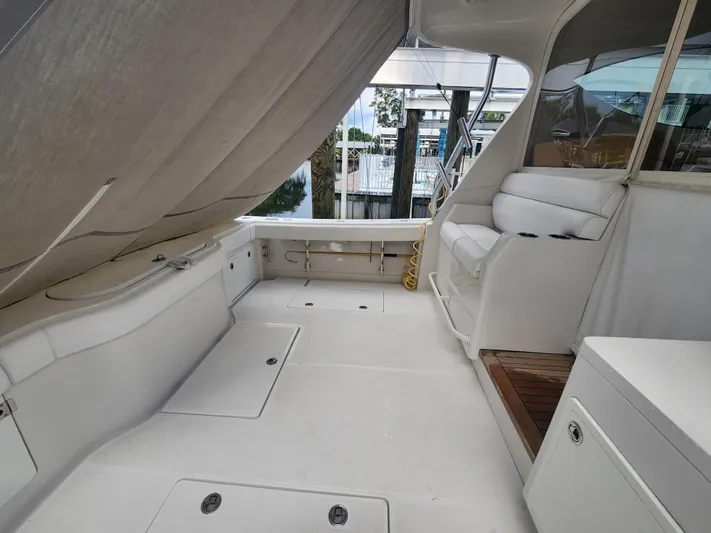  Yacht Photos Pics Spacious deck of 2015 Jupiter 41 SB yacht with seating and storage.