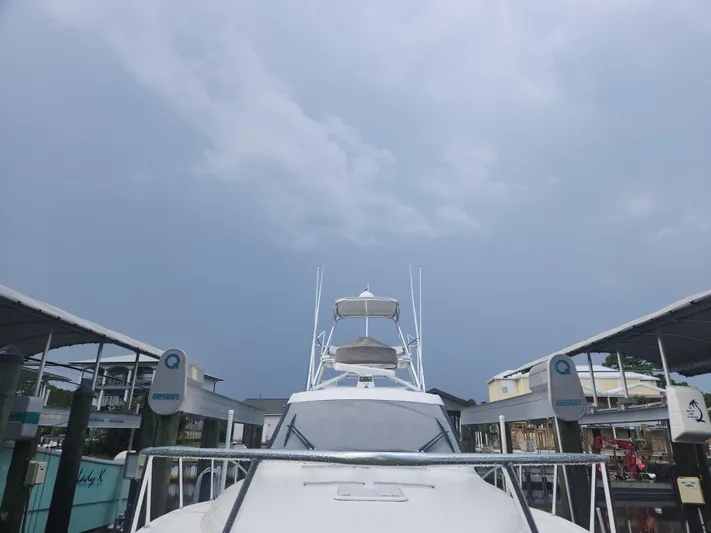  Yacht Photos Pics 2015 Jupiter 41 SB yacht docked under cloudy sky.