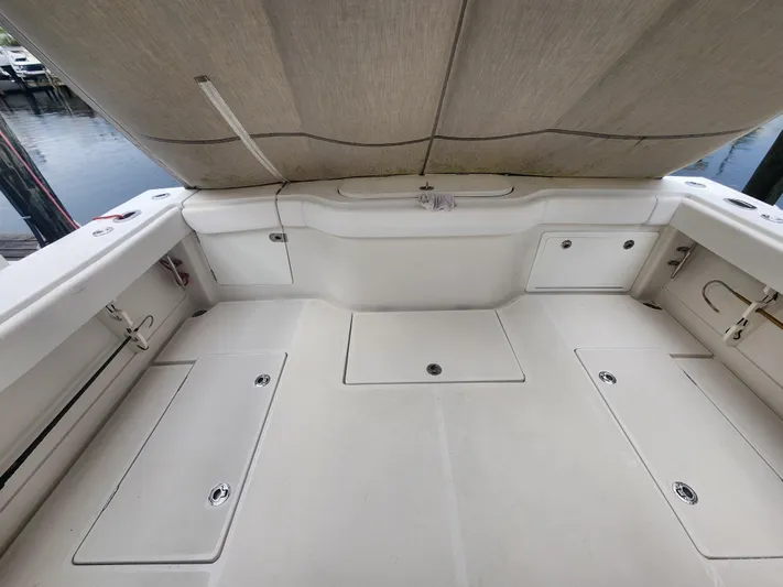  Yacht Photos Pics 2015 Jupiter 41 SB boat deck with storage compartments and canopy.
