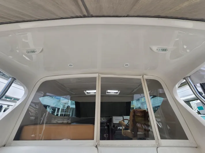  Yacht Photos Pics Interior view of 2015 Jupiter 41 SB yacht, featuring helm and seating area.